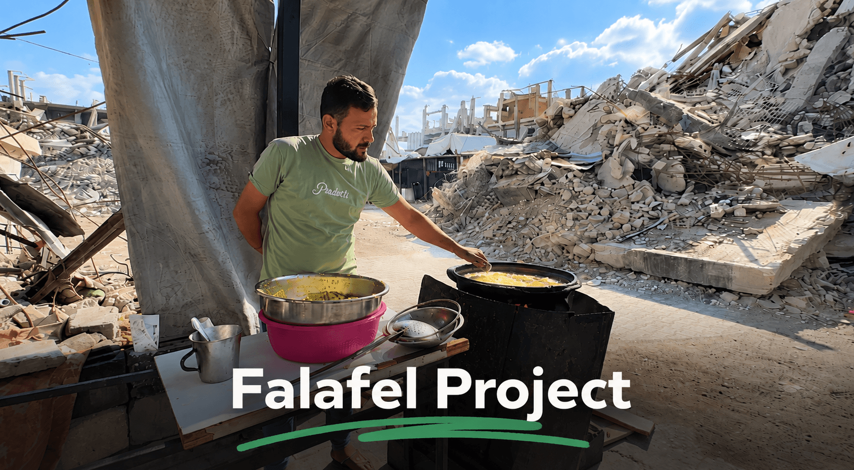 A Palestinian falafel vendor cooking amid the rubble